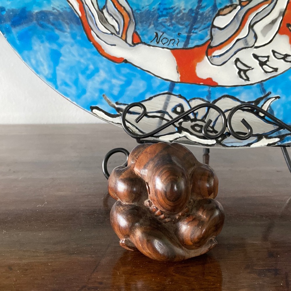 Wood carved meditating man figurine